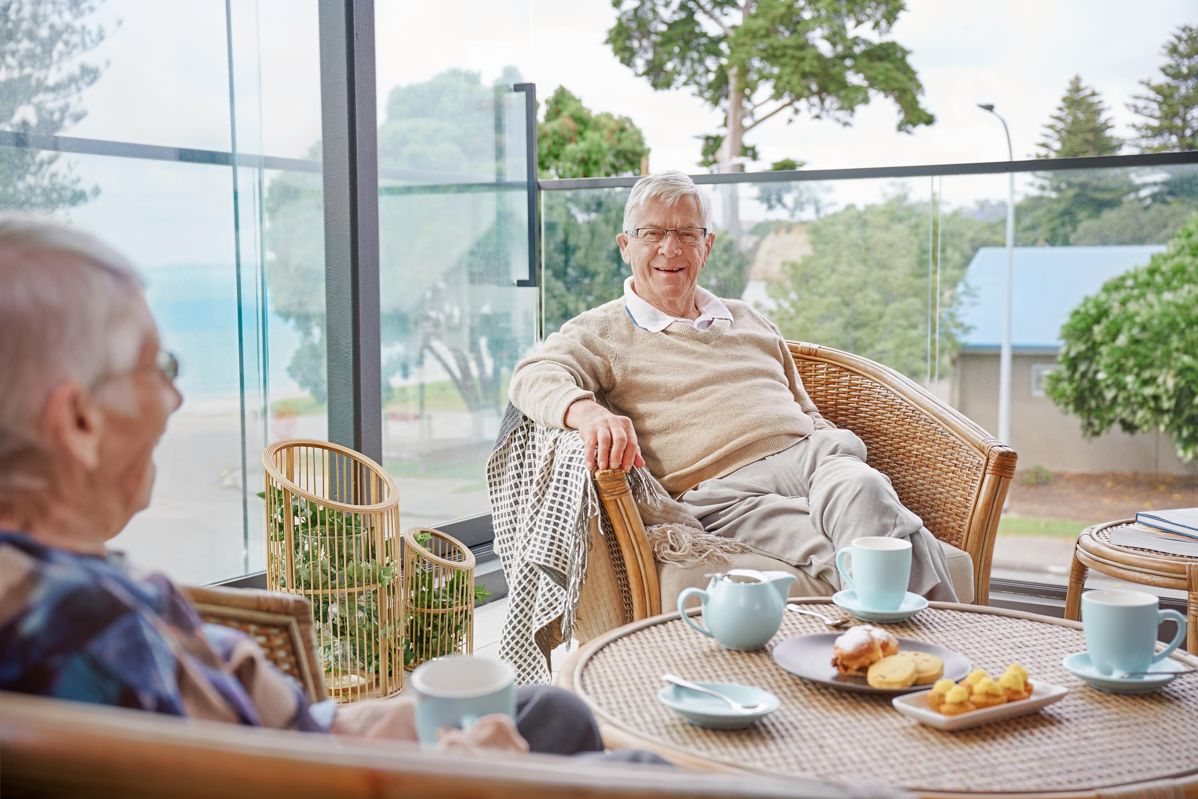 Oceania residents enjoying tea and sweets