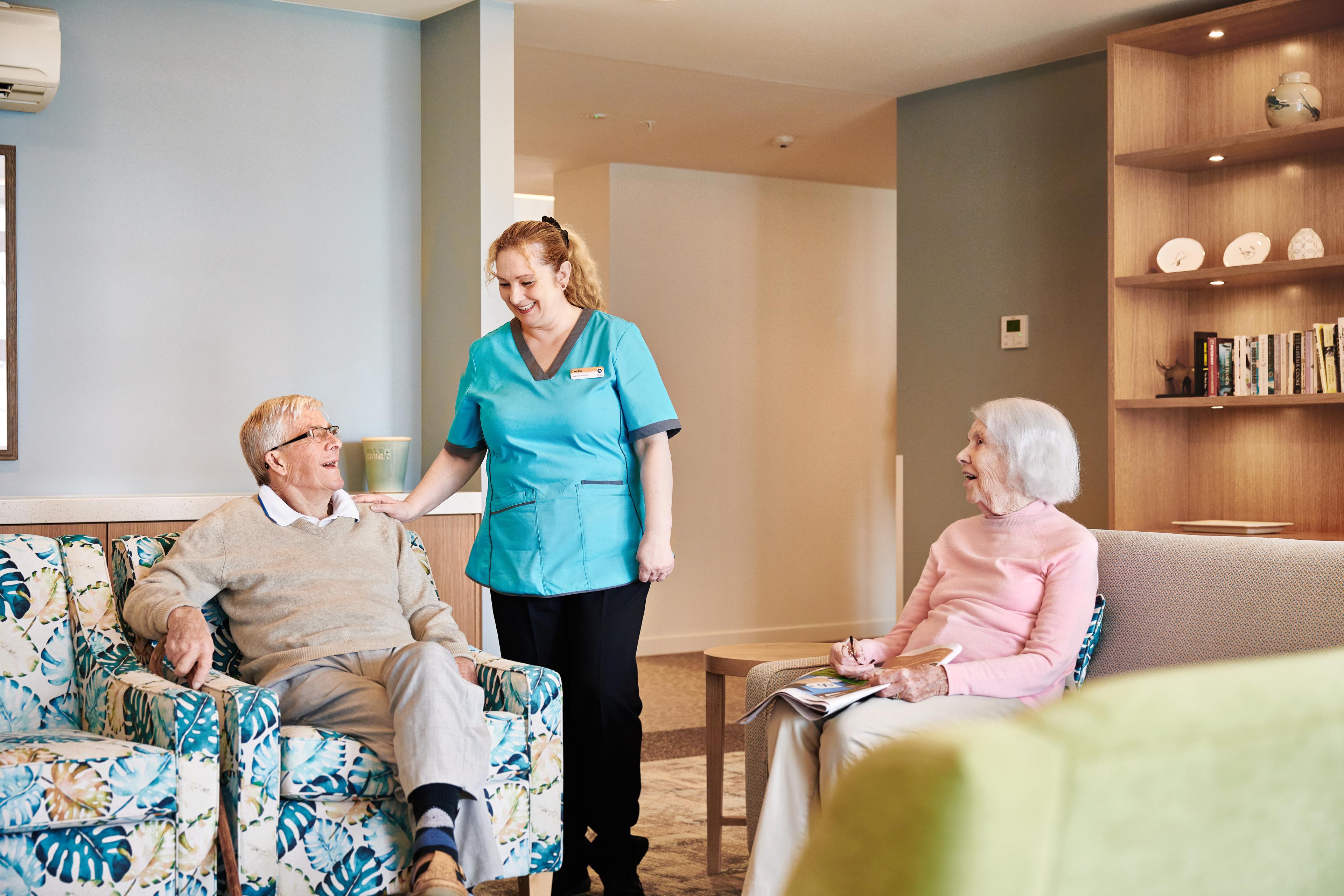 Oceania nurse laughing with a resident