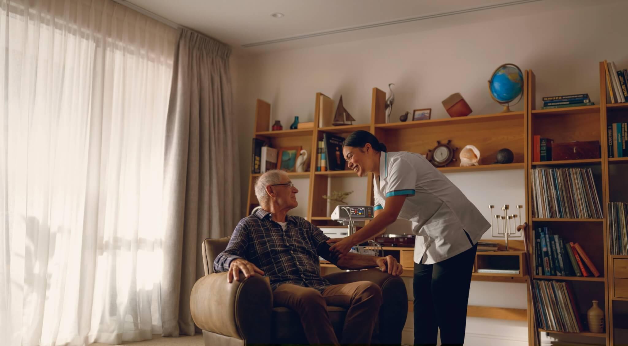 Senior person taken care by a nurse in a retirement living place