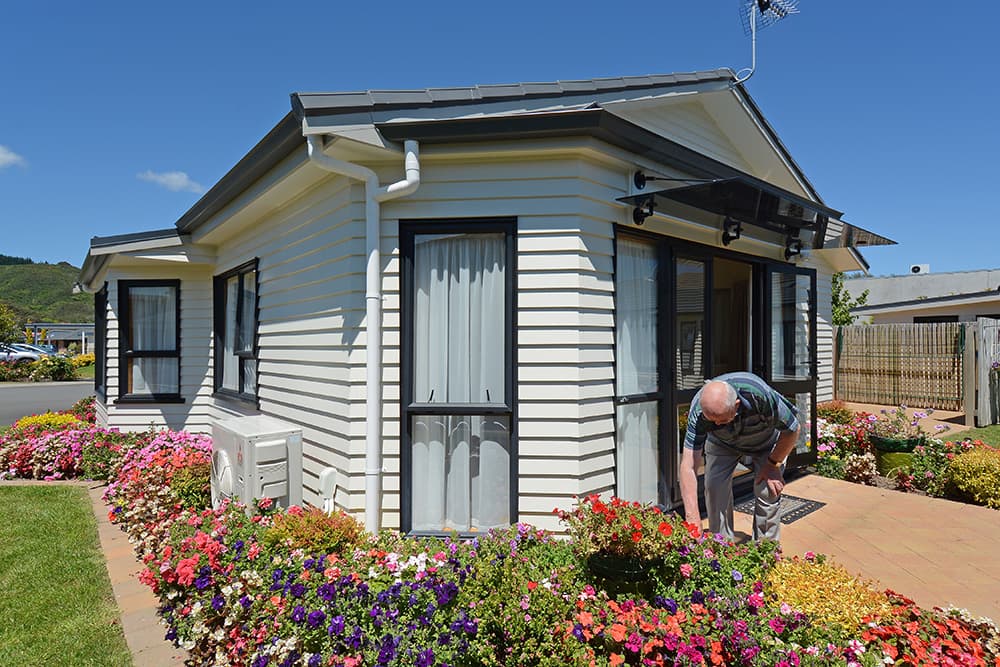 Hutt Gables resident gardening the flower beds
