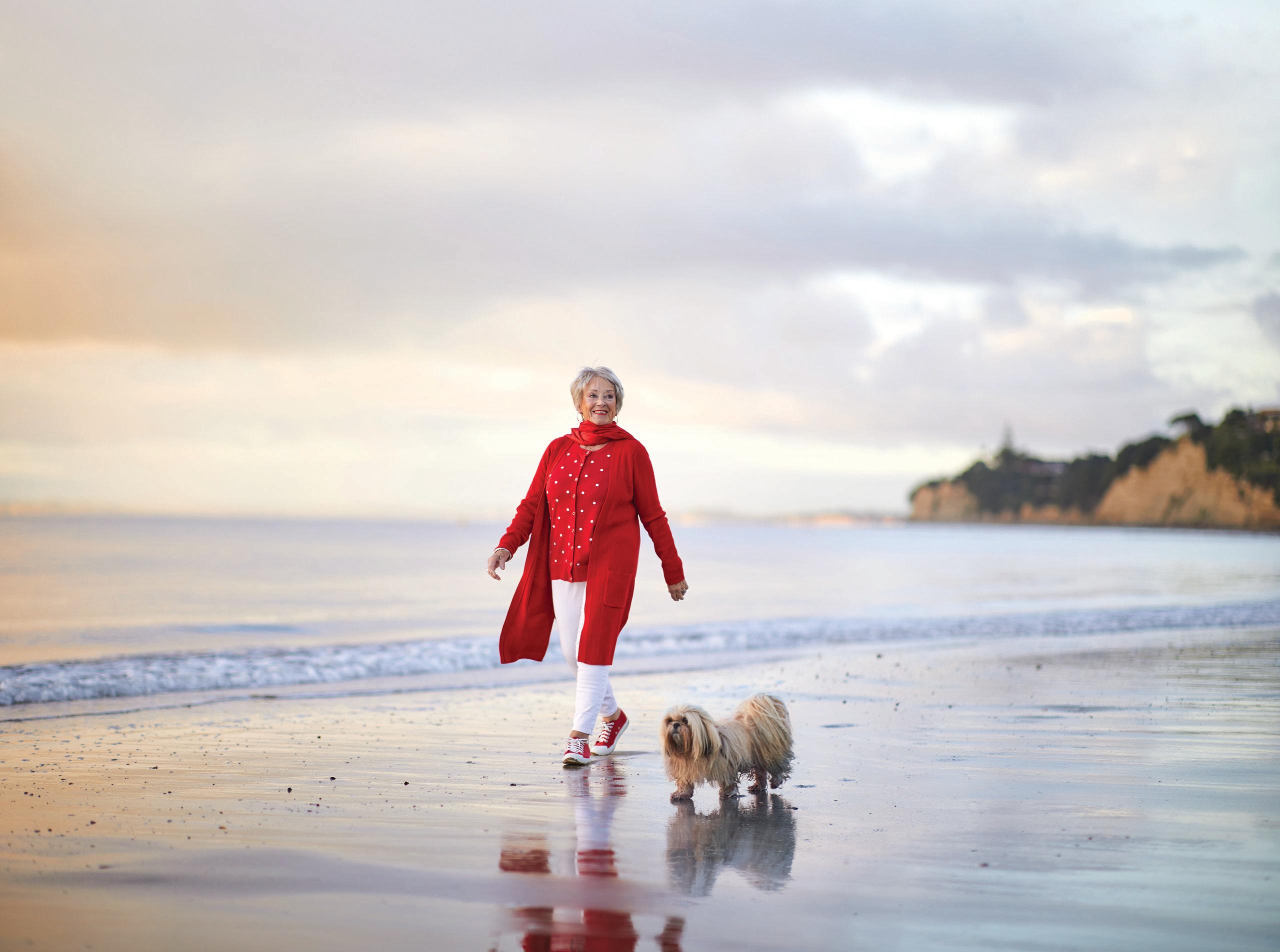 Oceania Residents enjoys a walk on the beach with her dog