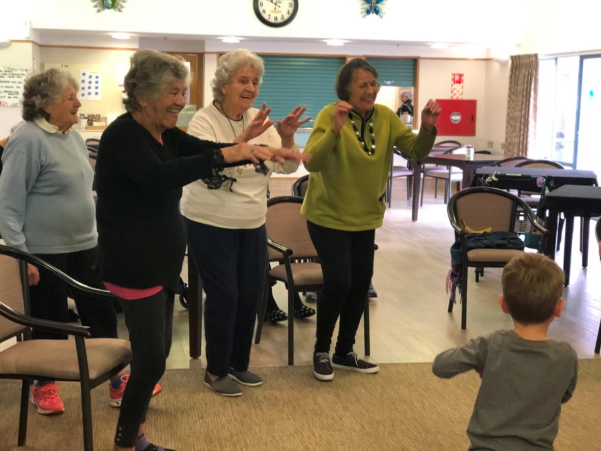 Wharerangi aged care centre elderly ladies dancing with children